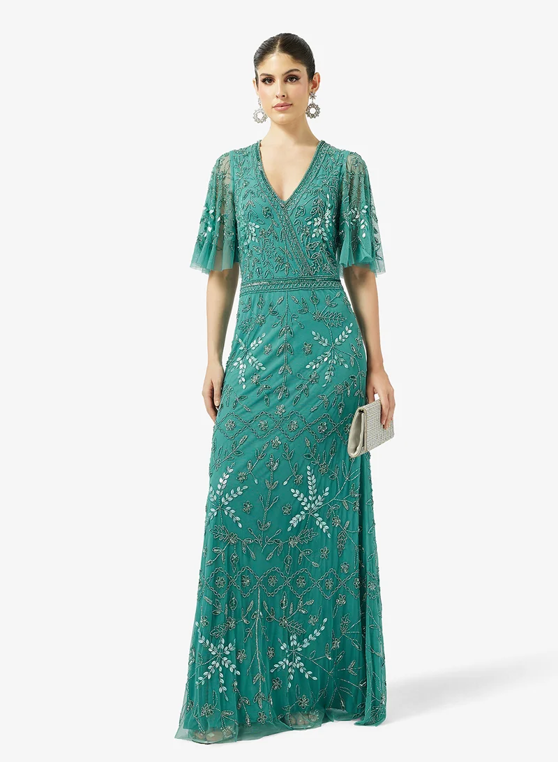 Namshi x Plunge Neck Bead Embellished Evening Gown